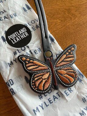 Portland Leather black and orange Monarca butterfly tassel NWT